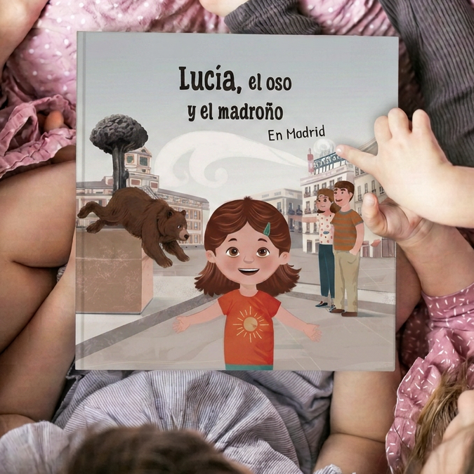 Niños viendo la portada del cuento de Madrid